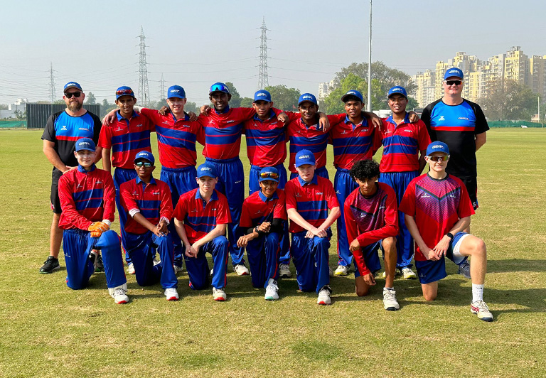 Cricketers from Complete Cricket Academy on an international tour, participating in competitive matches and cultural exchanges in India