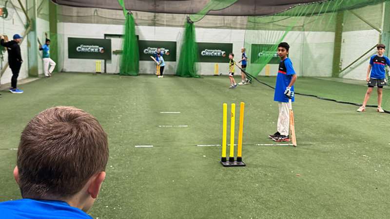 State-of-the-art training facilities at Complete Cricket, featuring indoor nets and equipment designed to enhance player performance and skill development.